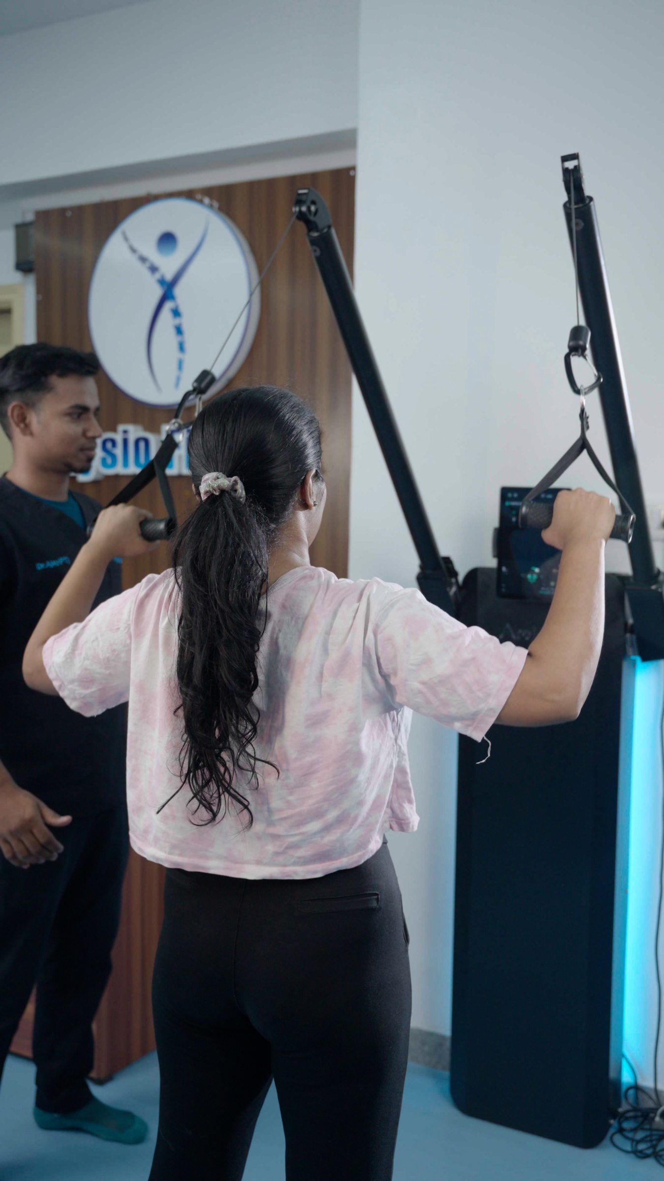 A patient performing a supervised upper-body movement on Aroleap